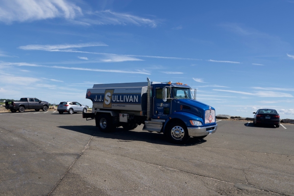 JJ Sullivan heating oil delivery truck under the blue sky