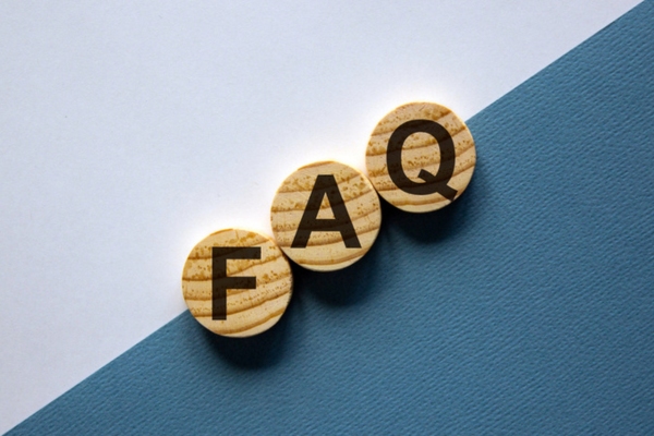 FAQ spelled using circular wooden letter chips depicting Signs of Leaky Air Ducts questions