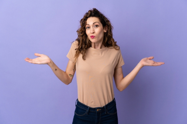 woman with hands raised on the side asking What Causes Water To Collect In An Oil Tank