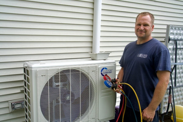 J.J. Sullivan HVAC technician performing service for a ductless AC