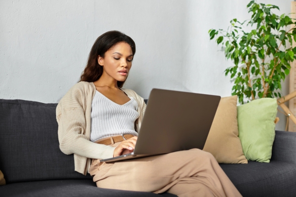 woman checking HVAC company references online using her laptop