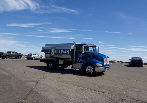 JJ Sullivan heating oil delivery truck under the blue sky