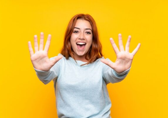 young lady holding 10 fingers up depicting 10 Practical Strategies for propane heating cost savings